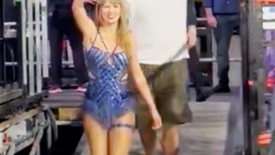 Travis Kelce proudly riles up Swifties as he leaves Eras Tour with Taylor Swift in Amsterdam