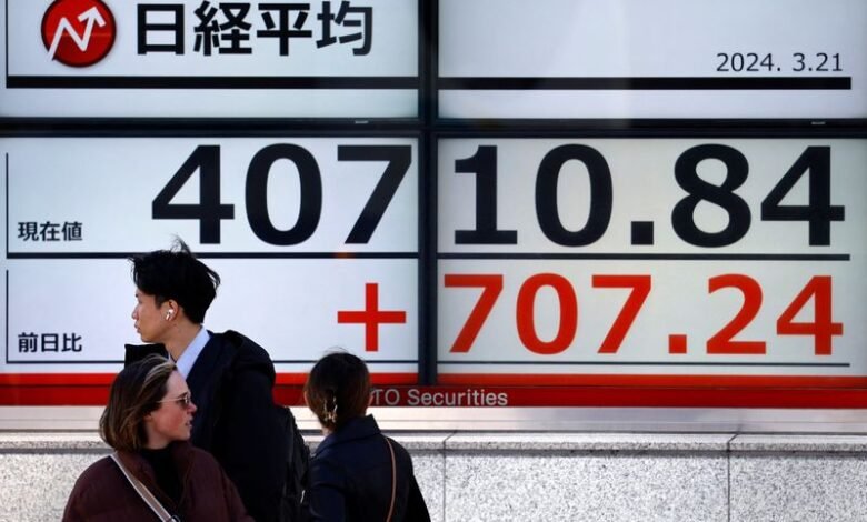 Asia shares underpinned, dollar undermined by dovish Fed wagers