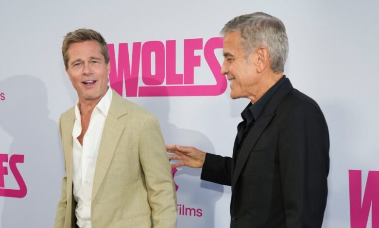 Watch Brad Pitt and George Clooney pal around on the red carpet at ‘Wolfs’ premiere