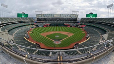 Grounds crew hands out dirt to fans as Oakland Coliseum hosts final A’s game