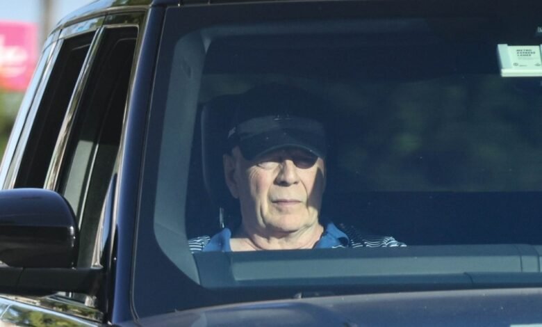 ‘Stable’ Bruce Willis, 69, seen riding in passenger side of car amid aphasia and dementia battles